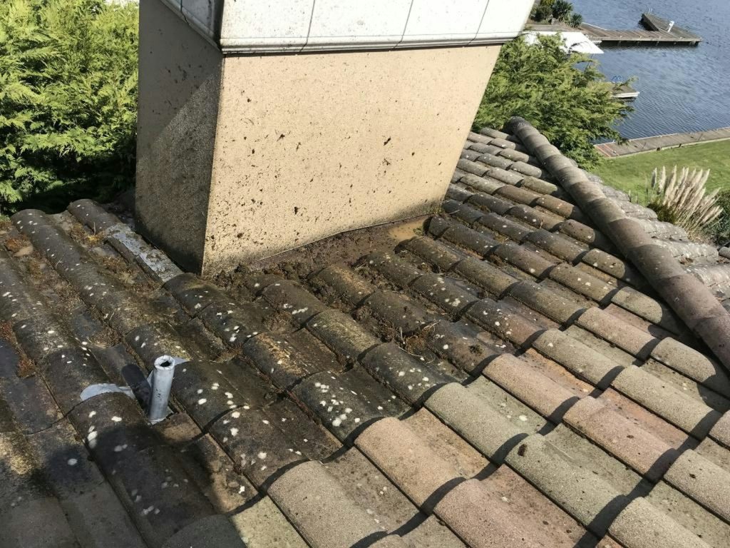 the roof of a house with a pipe sticking out of it